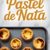 Pinterest vertical image with text “How to make Pastel de Nata” above a tray of golden, lightly scorched Portuguese custard tarts on a white marble surface.