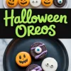 Collage featuring assorted Halloween-themed Oreo cookies decorated as pumpkins, mummies, and monsters with candy eyeballs and colorful candy melts, along with bold green “Halloween Oreos” text and a black plate displaying decorated cookies.