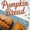 Sliced loaf of protein pumpkin bread on a slate board, topped with pumpkin seeds, with text overlay reading “Protein Pumpkin Bread.”