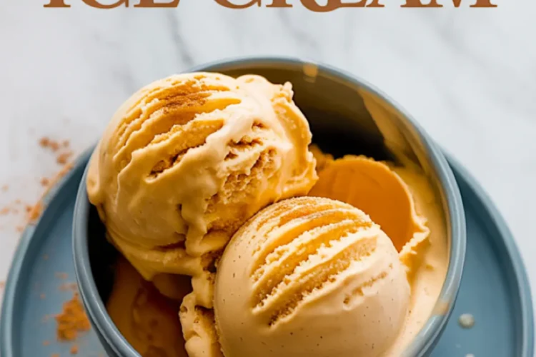 Blue ceramic bowl filled with scoops of pumpkin ice cream topped with cinnamon, placed on a matching plate with a gold spoon and decorative text reading “Pumpkin Ice Cream.”