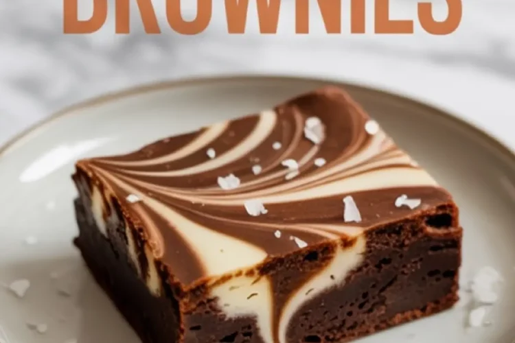Single sweet potato brownie with a striking cream cheese swirl and flaky salt flakes, served on a white plate with text overlay reading “Sweet Potato Brownies” in bold orange letters.
