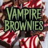 Stack of vampire brownies with glossy chocolate tops, cream cheese swirls, and vibrant raspberry filling, styled in a baking dish for a spooky Halloween dessert.