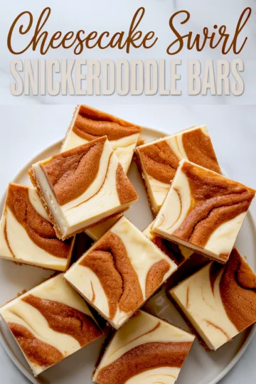 Flat lay of cheesecake swirl snickerdoodle bars on a white plate with text overlay, highlighting thick cream cheese filling and cinnamon sugar swirl top.
