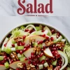 Overhead image of a holiday salad topped with sliced apples, celery, walnuts, pomegranate seeds, and cabbage in a white bowl, framed by bold red “Christmas Salad” text above.