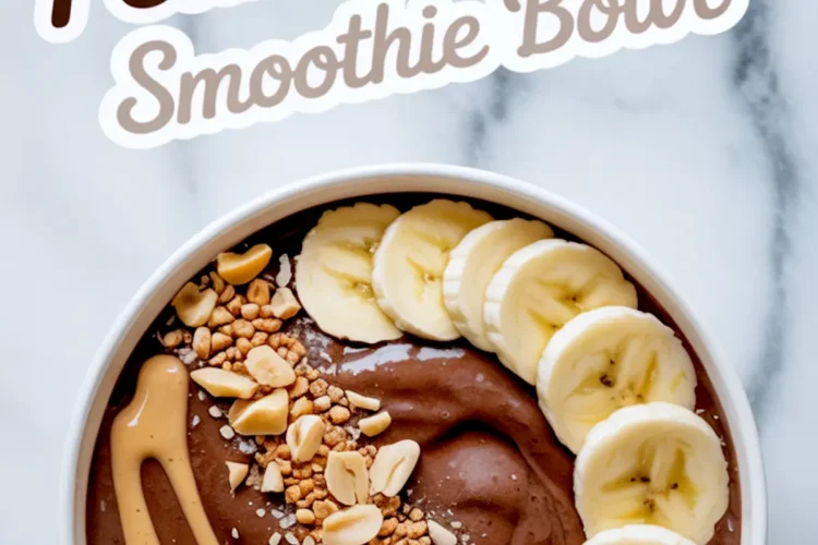 Flat lay of a rich chocolate smoothie base being poured from a blender into a white ceramic bowl, creating a smooth ripple effect.