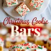 Frosted Christmas cookie bars topped with red, green, and white sprinkles displayed on a white marble plate, with a close-up of a single cookie bar layered with chocolate chips and white frosting below.