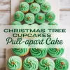 Christmas tree pull-apart cake made from cupcakes with green swirled buttercream frosting and festive sprinkles, arranged in a tree shape with a yellow star on top. A creative holiday dessert idea using buttercream frosting cupcakes.