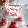 Layered cranberry mousse cups in clear glasses topped with sugared cranberries and fresh mint, with a bold overlay text that reads “Cranberry Mousse Cups” on a frosted background.