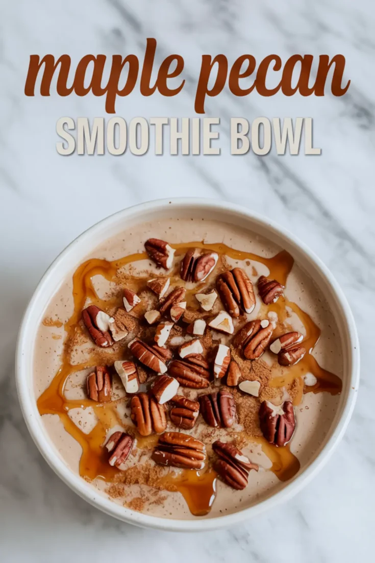 Maple pecan smoothie bowl topped with whole pecans, maple syrup drizzle, and a dusting of cinnamon, set against a light marble background with text overlay.