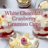 Overhead collage of individual white chocolate cranberry tiramisu dessert cups with sugared cranberries and white chocolate curls on marble, featuring bold center text overlay.