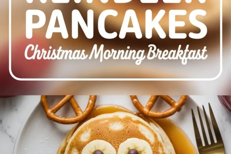 Christmas-themed reindeer pancakes arranged with pretzels, banana slices, chocolate chips, and a strawberry on a round stack, drizzled with maple syrup on a white plate. Bold text overlay reads “Reindeer Pancakes - Christmas Morning Breakfast.”