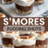 Glass dessert cups layered with graham cracker crumbs, chocolate pudding, and toasted marshmallows, topped with a chocolate square, styled with a “S’mores Pudding Shots” text overlay.