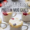 Collage displaying freshly baked vanilla berry protein mug cakes rising over white ceramic mugs, with golden tops bursting with blueberries, raspberries, and strawberries, surrounded by fresh berries on a marble background. Text overlay reads “Vanilla Berry Protein Mug Cakes”.