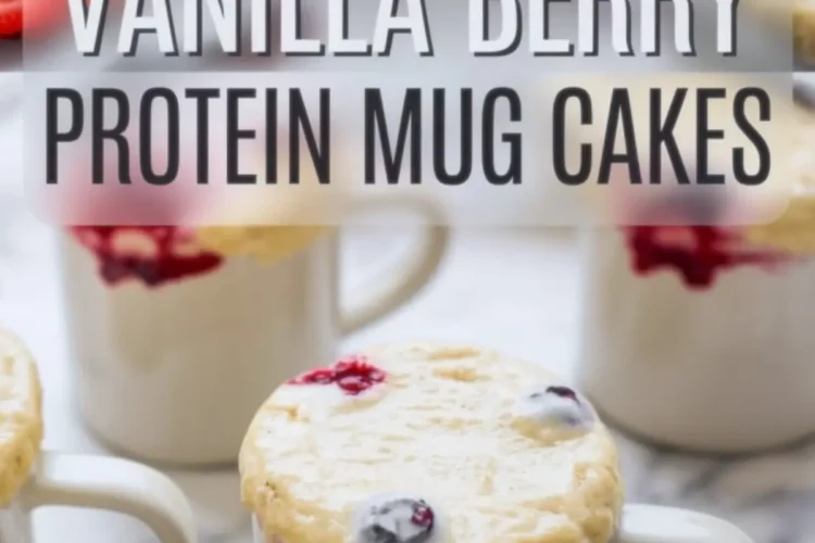 Collage displaying freshly baked vanilla berry protein mug cakes rising over white ceramic mugs, with golden tops bursting with blueberries, raspberries, and strawberries, surrounded by fresh berries on a marble background. Text overlay reads “Vanilla Berry Protein Mug Cakes”.
