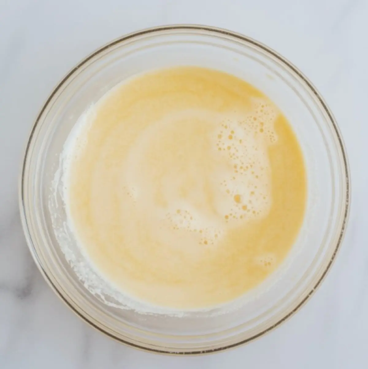 Cornstarch slurry mixed in a small bowl before being added to thicken berry cake filling.