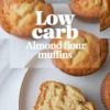 Collage with a centered “low carb almond flour muffins” text overlay, showing muffins arranged on a marble background with a sliced piece displayed on a white plate.