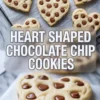 Heart-shaped chocolate chip cookies cooling on a wire rack with text overlay “Heart Shaped Chocolate Chip Cookies,” highlighting the soft texture and glossy chocolate chip topping.