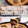 Valentine’s Day cookie skillet with pink and chocolate heart candies baked into golden cookie dough, shown in a cast iron pan with a spoon lifting a gooey melted chocolate bite, perfect for romantic dessert boards and heart-themed baking ideas.