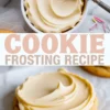 Vertical 1:2 collage shows bowl of silky vanilla frosting with offset spatula on top and frosted sugar cookie on bottom. Large centered text reads COOKIE FROSTING RECIPE over marble background.