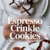 Small glass bowl holds brewed espresso topped with espresso powder beside a metal spoon on a marble countertop. Strong coffee mixture adds bold flavor to homemade espresso crinkle cookies.