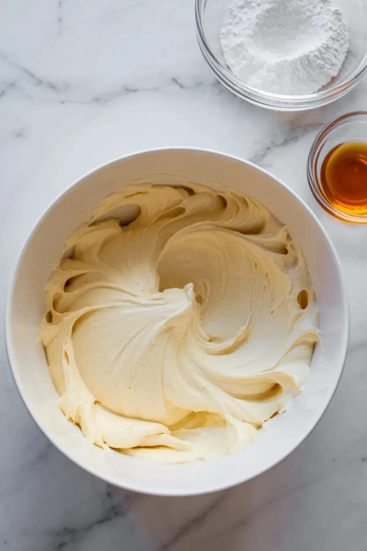 Ingredients for no-bake almond cherry dream bars arranged in bowls, including cherries, almonds, cream mixture, and crumb ingredients.