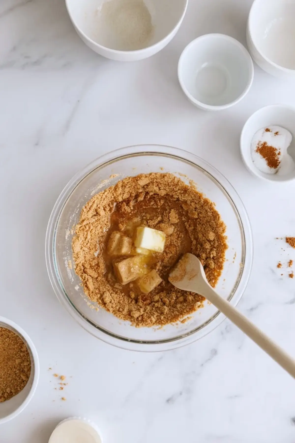 Crumb base mixture pressed into a pan for no-bake almond cherry dream bars.