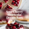 Several sour cherry shortcake dream bars arranged on a white plate, showing the glossy cherry topping and creamy layered centers from above.