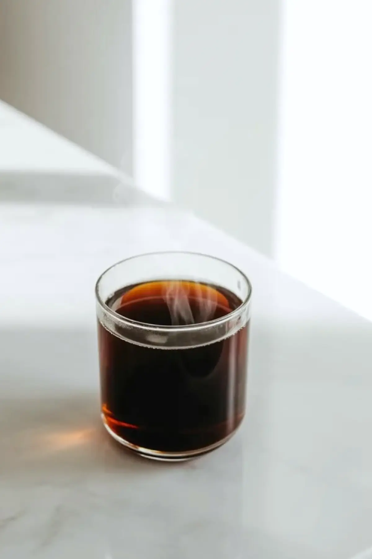 Fresh brewed coffee in a clear glass, showing the coffee base used for the coconut coffee smoothie recipe.