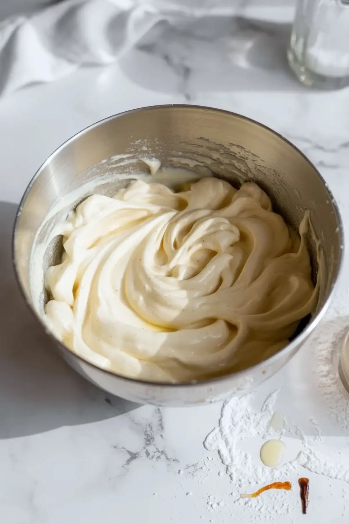 Creamy coconut filling for coconut pineapple cream pie bars whipped in a mixing bowl until smooth and thick.