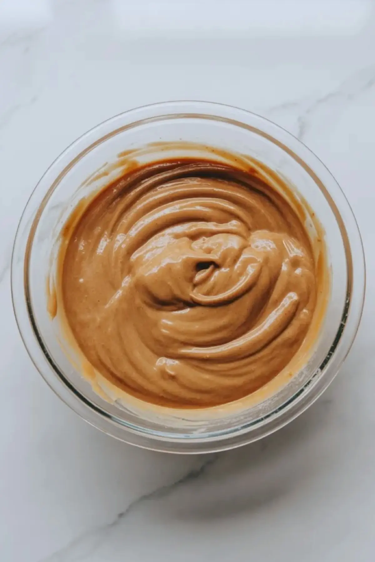 Smooth blondie batter mixed until glossy for patriotic funfetti blondies before the mix-ins are folded in.