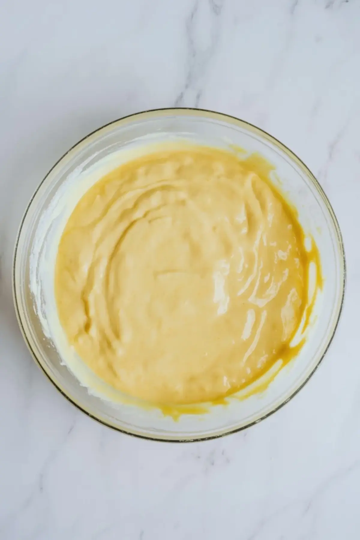 Smooth lemon filling in a bowl before it is spread into the graham cracker crust for patriotic lemon icebox pie.