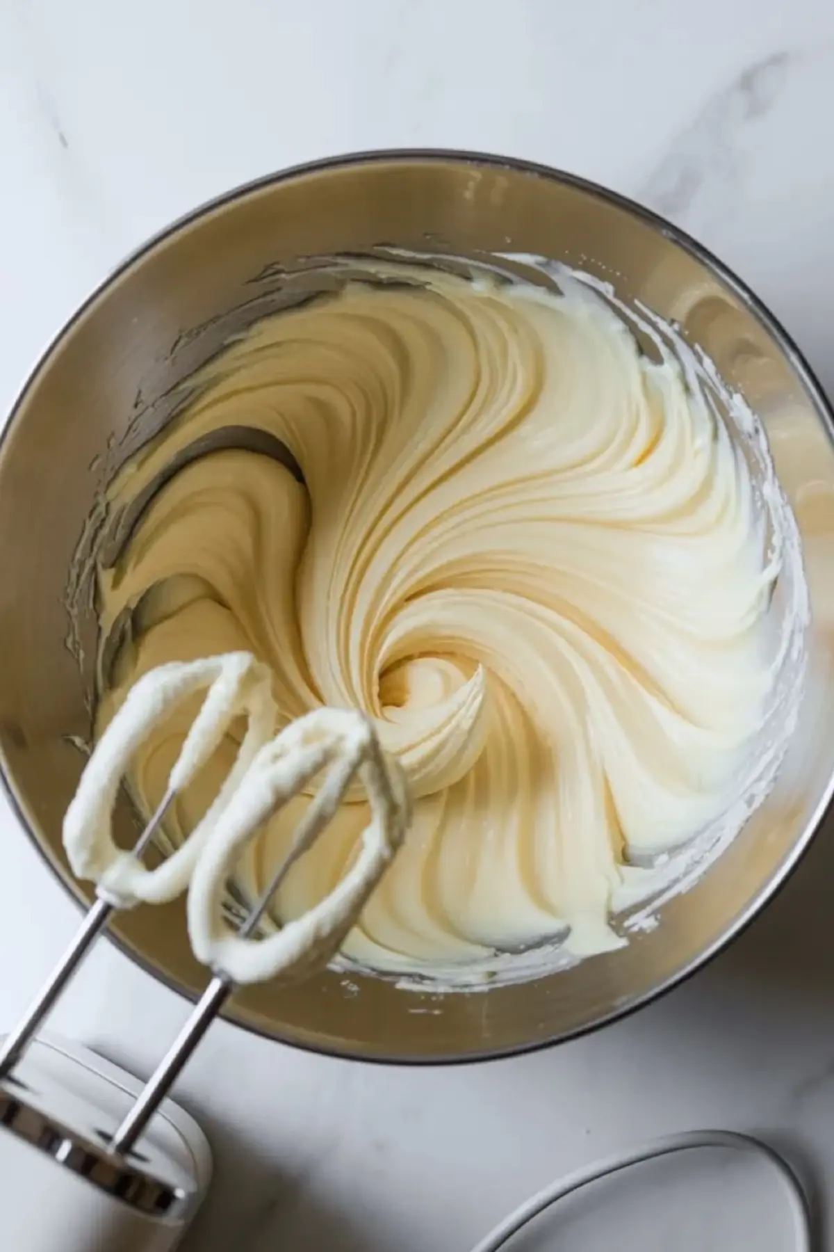 Creamy lemon pie filling being mixed until smooth for patriotic lemon icebox pie.