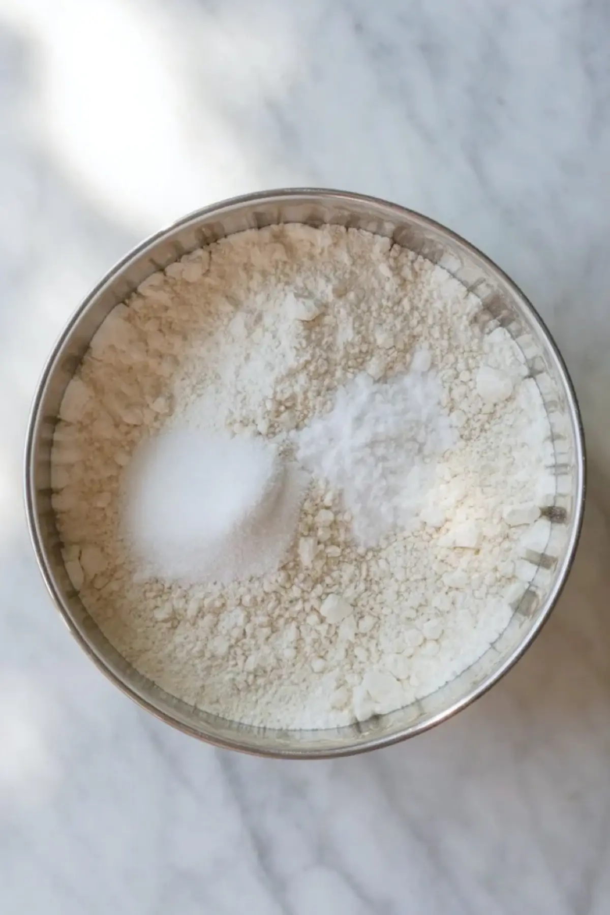 Dry ingredients mixed in a bowl for patriotic sugar cookie bars before combining with the butter mixture.