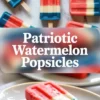 Patriotic watermelon popsicles with red, white, and blue layers arranged on a plate, shown with one frosty popsicle in the foreground.