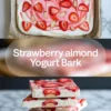 Featured strawberry yogurt bark image showing the finished tray above and stacked frozen bark pieces with fresh strawberries and almonds below.