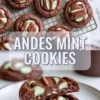 Andes mint cookies on a cooling rack with glossy melted mint chocolate centers and a cut cookie stack showing the soft fudgy middle beneath the topping.