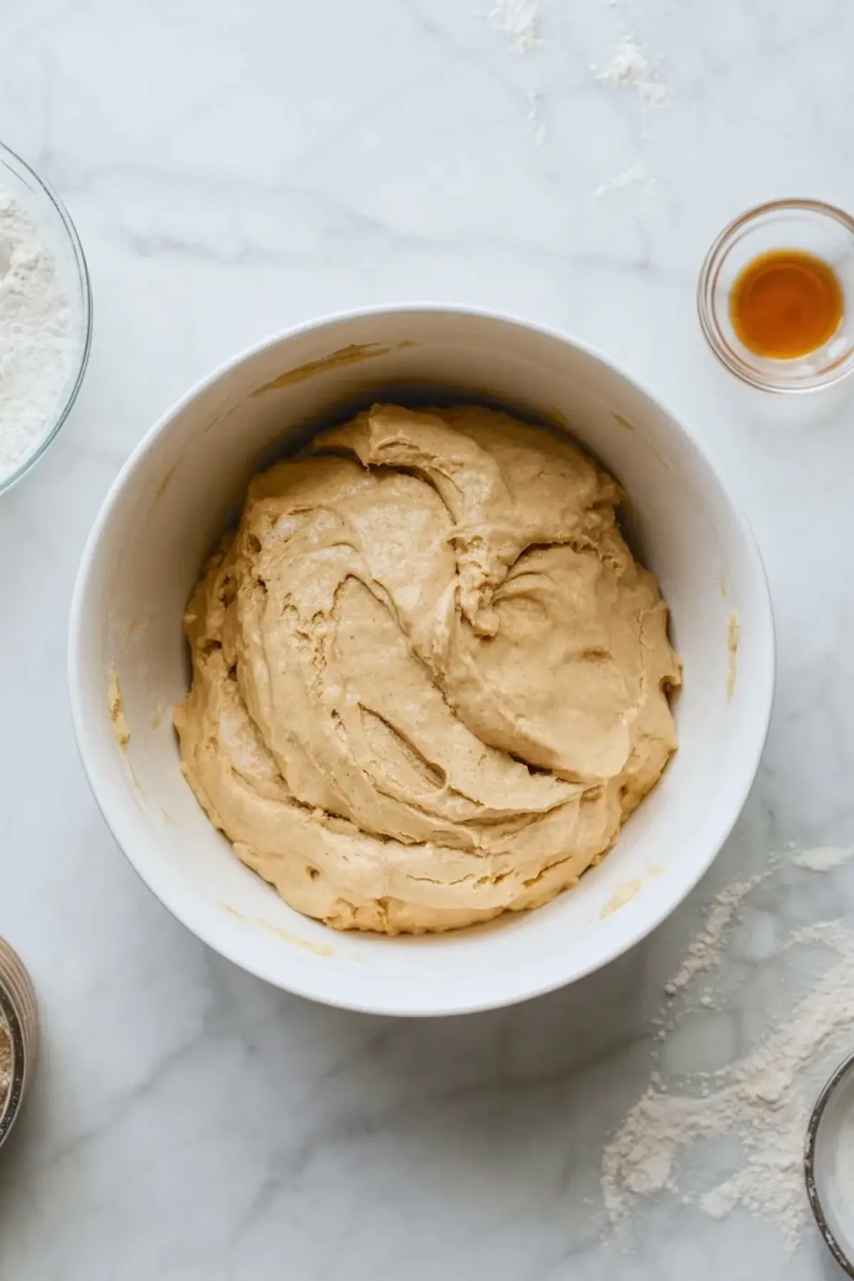Soft cookie dough for raspberry cheesecake cookies mixed in a bowl before shaping and stuffing.