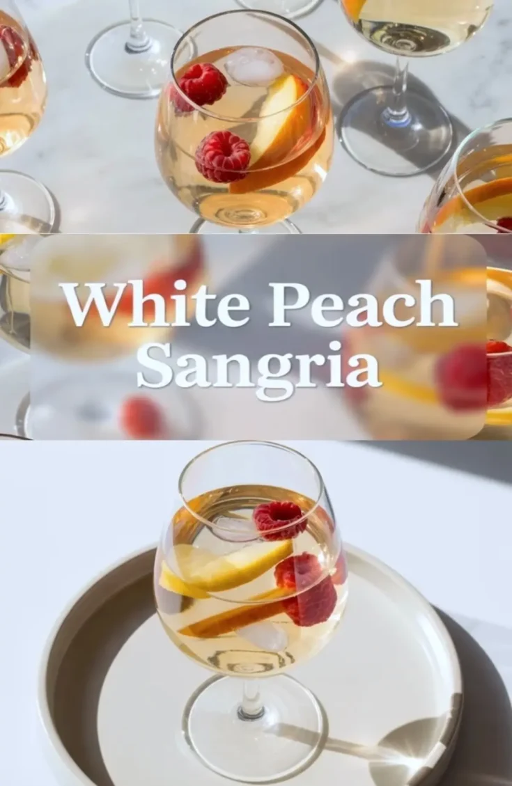 White peach sangria in stemmed glasses with peach slices, berries, ice, and white peach sangria title text in a bright summer serving graphic.
