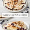 Blueberry breakfast quesadillas cut into wedges with cream cheese filling and blueberries visible inside.