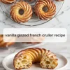 Vanilla glazed French crullers on a rack with a cut cruller showing the airy choux interior.
