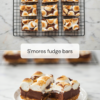 S'mores fudge bars with toasted marshmallow tops cooling on a wire rack, above two bars on a plate showing the graham crust and thick chocolate fudge.